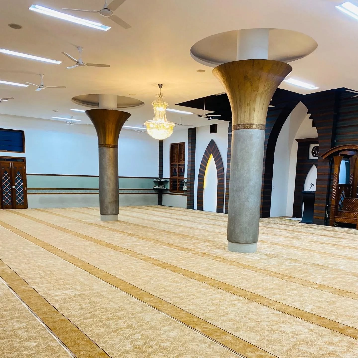 Wholesale Turkish masjid carpet rolls stacked for distribution in Kerala
    